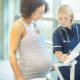 pregnant woman with a midwife